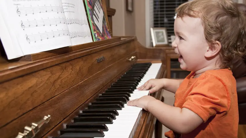 Lagrima Digital Piano Review.  Cute kid playing acoustic piano.