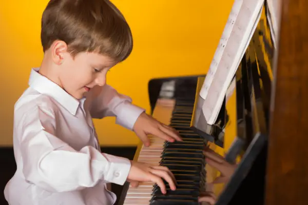 Young Boy Playing a Piano